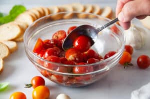 toss the halved tomatoes with oil