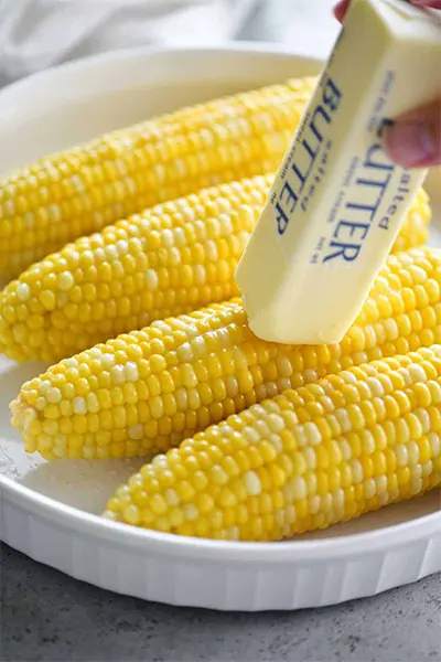 buttering the corn