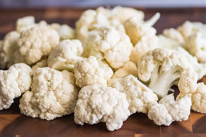 chopping and tossing the cauliflower