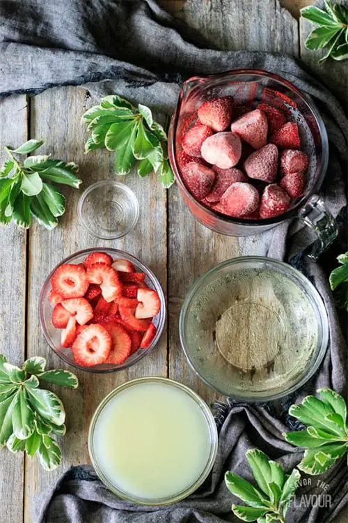 preparing the ingredients for rosemary strawberry daiquiri