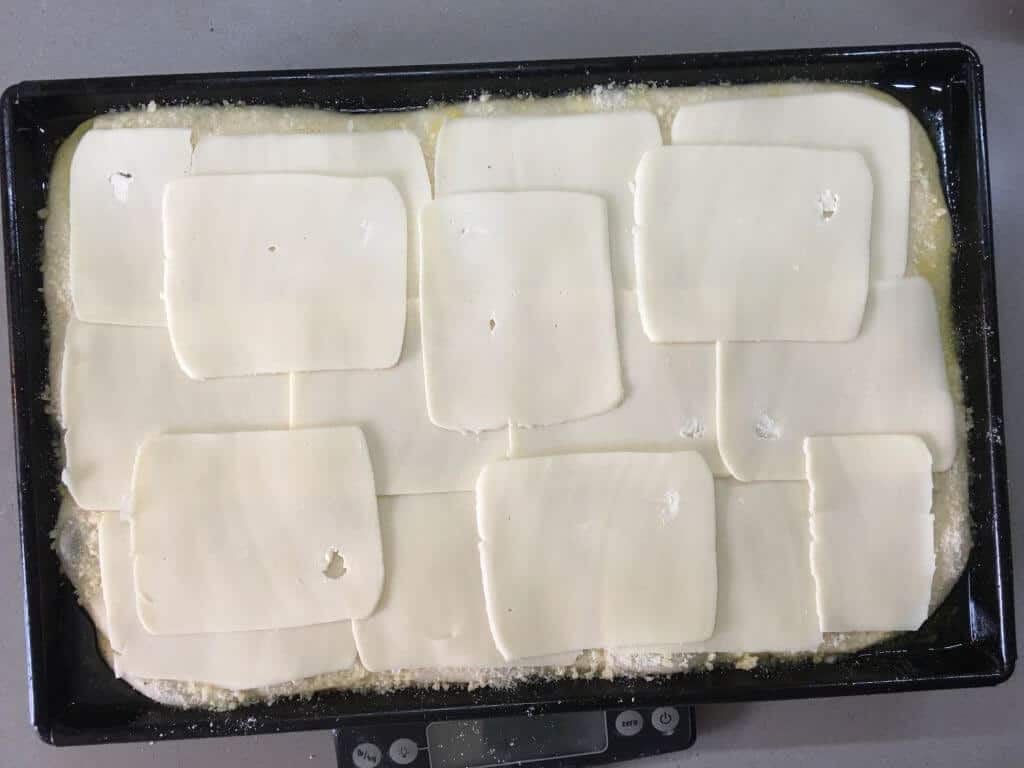 cover dough with mozzarella cheese