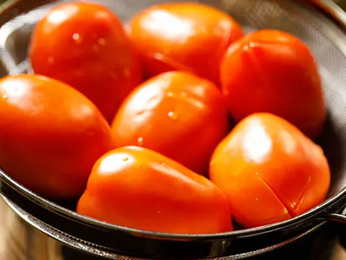 Strain the tomatoes in a colander or strainer