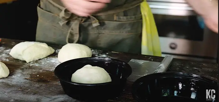 place dough balls in separate containers 