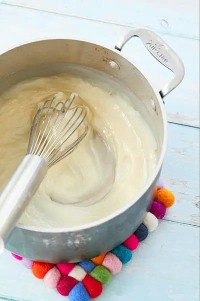 preparing whipped cream frosting